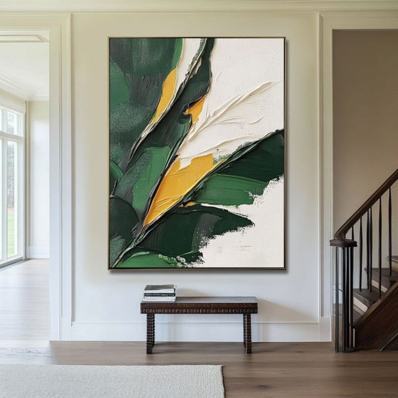Abstract painting with green and yellow tones in a modern interior setting.